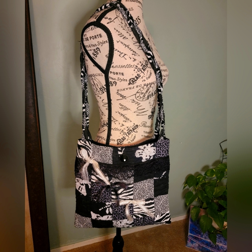 Black and white quilted patchwork shoulder bag with inner lining musical notes